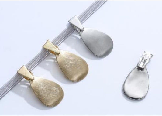 Brushed Metal Earrings Featuring an Organic Teardrop Form